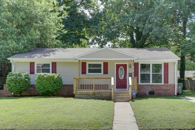 1621 Bill St, Norfolk, VA 23518 - view of front of house featuring a front yard, a porch, roof with shingles, and brick siding