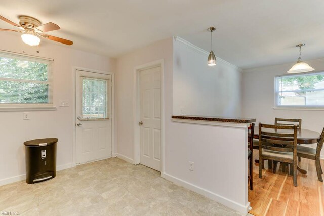 1621 Bill St, Norfolk, VA 23518 - dining room with baseboards, ceiling fan, and crown molding