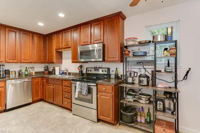 1621 Bill St, Norfolk, VA 23518 - kitchen featuring appliances with stainless steel finishes, a sink, brown cabinetry, recessed lighting, and a ceiling fan