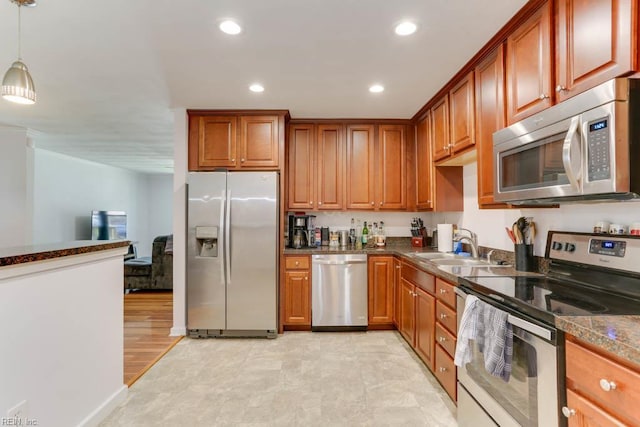 1621 Bill St, Norfolk, VA 23518 - kitchen featuring appliances with stainless steel finishes, recessed lighting, decorative light fixtures, brown cabinets, and crown molding