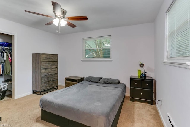 1621 Bill St, Norfolk, VA 23518 - bedroom featuring a baseboard heating unit, light carpet, ceiling fan, baseboards, and a closet