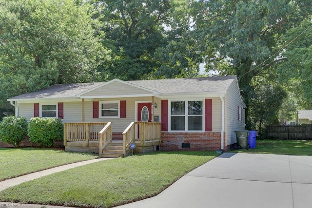 1621 Bill St, Norfolk, VA 23518 - view of front facade featuring a porch, brick siding, roof with shingles, and crawl space