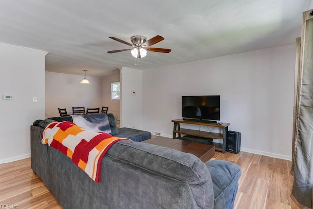 1621 Bill St, Norfolk, VA 23518 - living room with light wood finished floors, a ceiling fan, baseboards, and ornamental molding