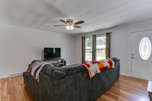 1621 Bill St, Norfolk, VA 23518 - living room featuring healthy amount of natural light, ceiling fan, wood finished floors, baseboards, and ornamental molding