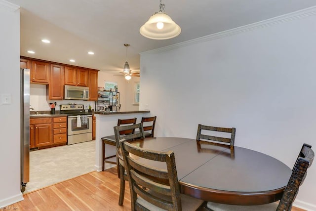 1621 Bill St, Norfolk, VA 23518 - dining room with light wood finished floors, recessed lighting, crown molding, and a ceiling fan