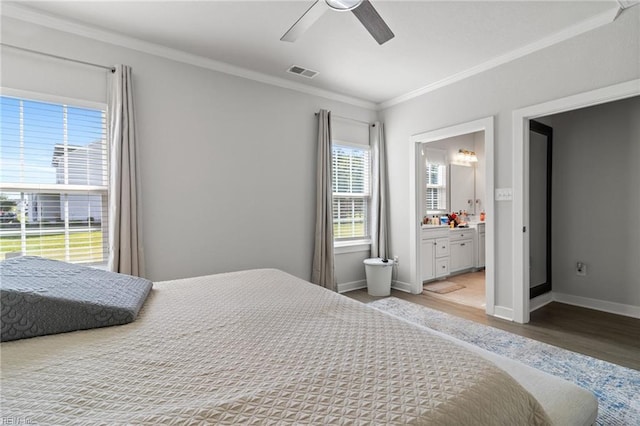 110 Georgia Dr, Elizabeth City, NC 27909 - bedroom with light wood-style floors, ornamental molding, baseboards, ceiling fan, and ensuite bath