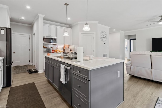 110 Georgia Dr, Elizabeth City, NC 27909 - kitchen with appliances with stainless steel finishes, gray cabinets, white cabinetry, open floor plan, and ornamental molding