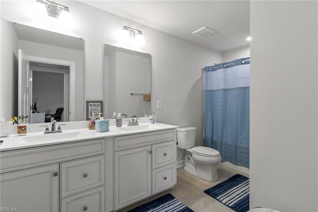 110 Georgia Dr, Elizabeth City, NC 27909 - bathroom with double vanity, toilet, and a shower with shower curtain