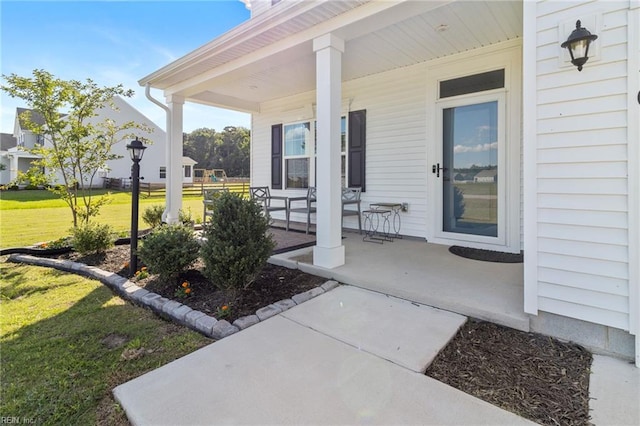110 Georgia Dr, Elizabeth City, NC 27909 - view of exterior entry with a porch and a lawn