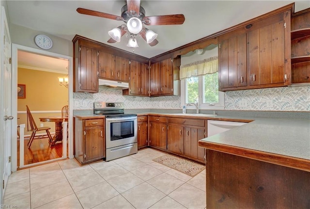 7 Saint Francis Dr, Newport News, VA 23602 - kitchen with stainless steel electric stove, under cabinet range hood, a sink, backsplash, and crown molding