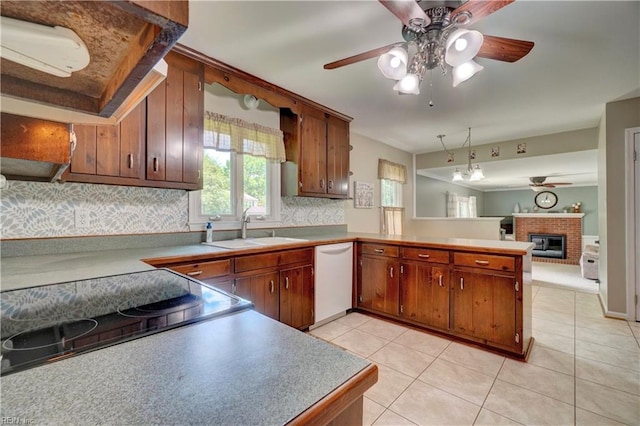 7 Saint Francis Dr, Newport News, VA 23602 - kitchen with dishwasher, a sink, a ceiling fan, a peninsula, and brown cabinets