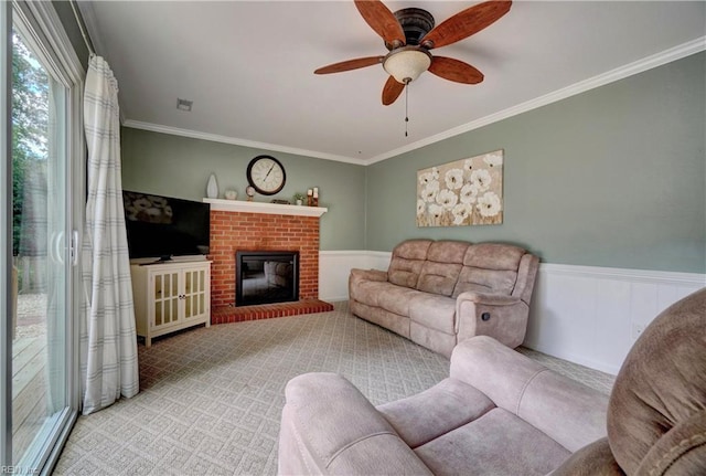 7 Saint Francis Dr, Newport News, VA 23602 - carpeted living area with ornamental molding, ceiling fan, wainscoting, and a fireplace