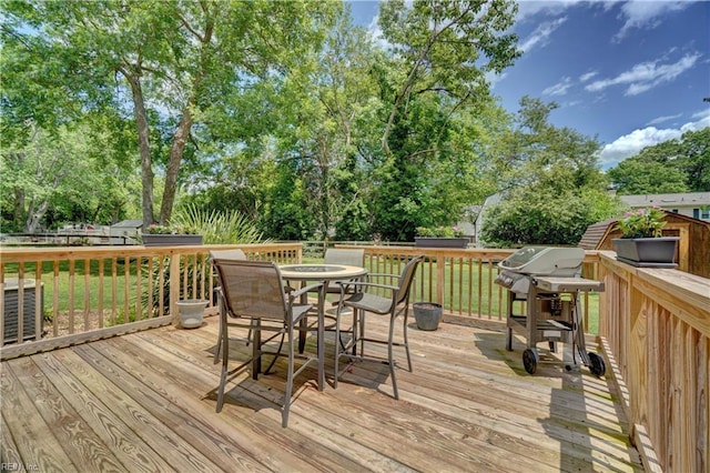 7 Saint Francis Dr, Newport News, VA 23602 - deck with outdoor dining area, a grill, view of scattered trees, and a yard