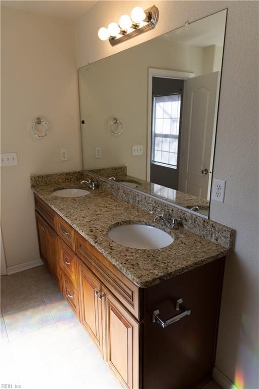 1932 Linster St, Chesapeake, VA 23324 - bathroom with double vanity, tile patterned flooring, and baseboards