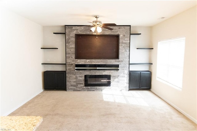 1932 Linster St, Chesapeake, VA 23324 - unfurnished living room featuring carpet flooring, a stone fireplace, a ceiling fan, and baseboards
