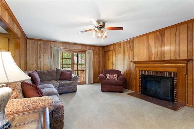 8 Marilea Cir, Newport News, VA 23606 - living room featuring carpet, a ceiling fan, wooden walls, a brick fireplace, and crown molding