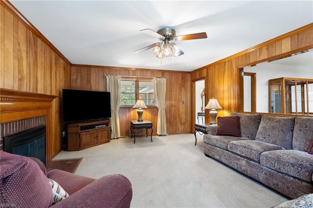 8 Marilea Cir, Newport News, VA 23606 - living room with wood walls, light colored carpet, crown molding, ceiling fan, and a fireplace with flush hearth