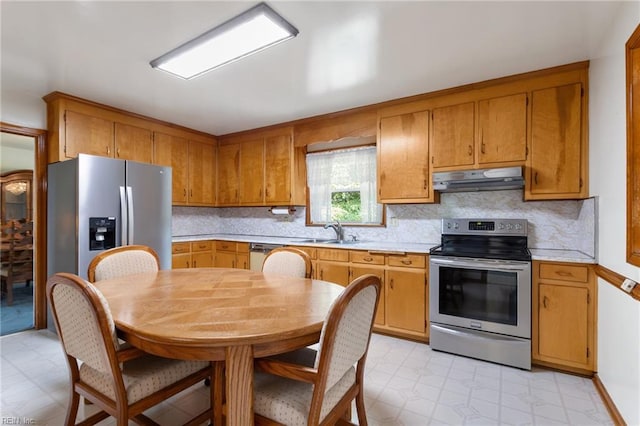 8 Marilea Cir, Newport News, VA 23606 - kitchen with appliances with stainless steel finishes, under cabinet range hood, a sink, light countertops, and tasteful backsplash