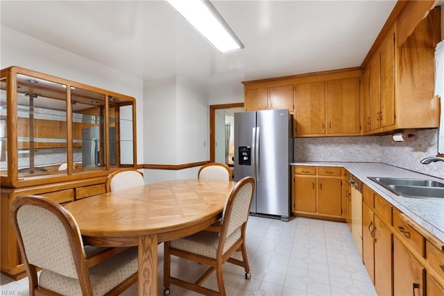 8 Marilea Cir, Newport News, VA 23606 - kitchen featuring stainless steel fridge, a sink, light countertops, freestanding refrigerator, and light flooring