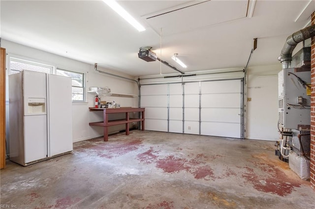 8 Marilea Cir, Newport News, VA 23606 - garage with white refrigerator with ice dispenser and a garage door opener