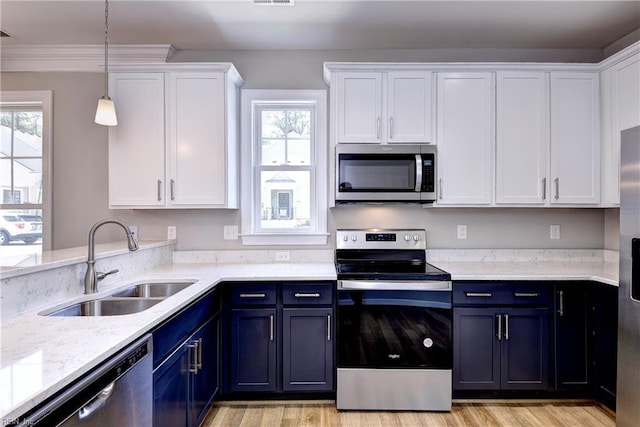 3545 Amberley Way, Williamsburg, VA 23188 - kitchen with appliances with stainless steel finishes, a sink, blue cabinetry, white cabinetry, and light wood-style floors