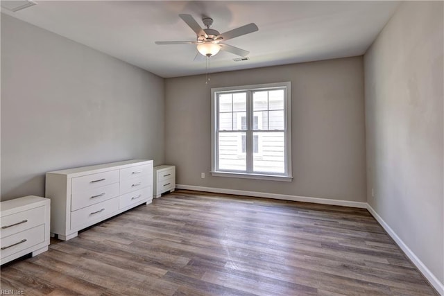 3545 Amberley Way, Williamsburg, VA 23188 - spare room featuring a ceiling fan, dark wood-style flooring, and baseboards