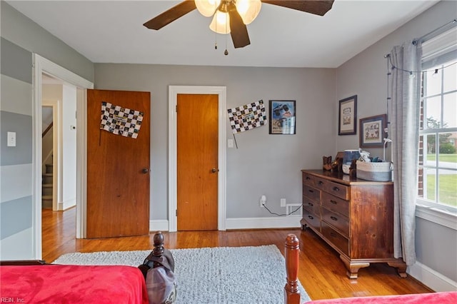 108 Pocahontas St, Franklin, VA 23851 - bedroom with wood finished floors, baseboards, and a ceiling fan