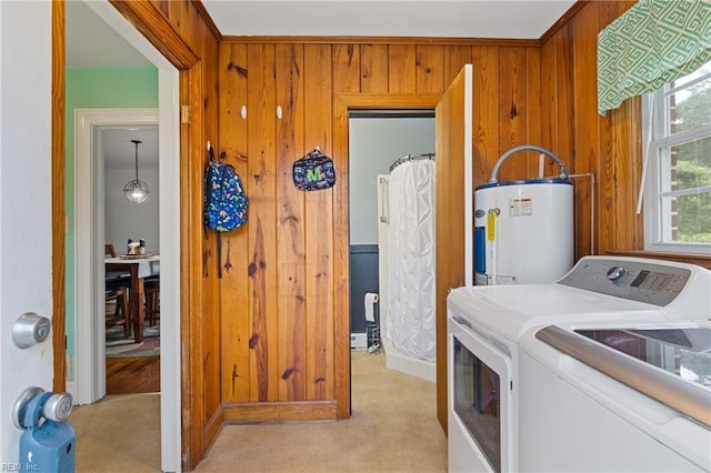 108 Pocahontas St, Franklin, VA 23851 - washroom with water heater, washing machine and clothes dryer, and wooden walls
