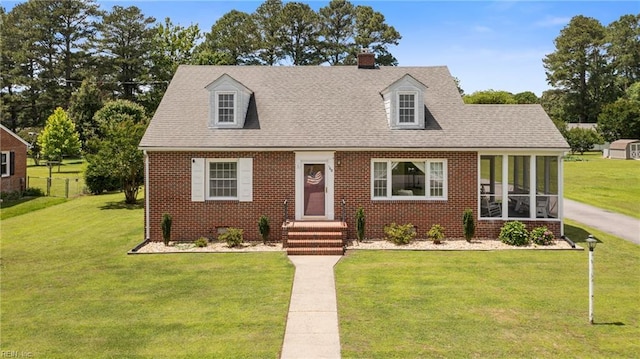 108 Pocahontas St, Franklin, VA 23851 - new england style home with brick siding, roof with shingles, and a chimney