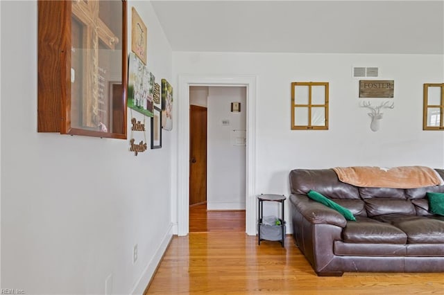 108 Pocahontas St, Franklin, VA 23851 - living room featuring light wood-style flooring and baseboards