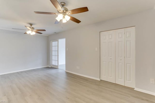 722 White Hall Ln, Virginia Beach, VA 23464 - unfurnished bedroom featuring light wood-type flooring, baseboards, a closet, and a ceiling fan