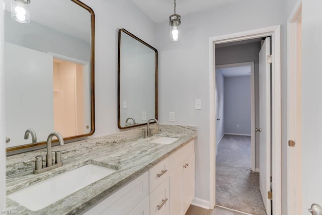 722 White Hall Ln, Virginia Beach, VA 23464 - full bathroom with double vanity and baseboards