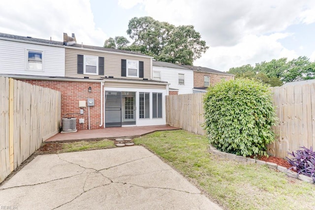722 White Hall Ln, Virginia Beach, VA 23464 - rear view of house with a wooden deck, brick siding, a fenced backyard, and central AC