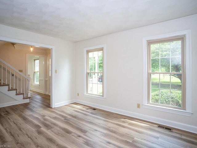 3124 Douglas Rd, Chesapeake, VA 23322 - unfurnished room featuring plenty of natural light, baseboards, and wood finished floors