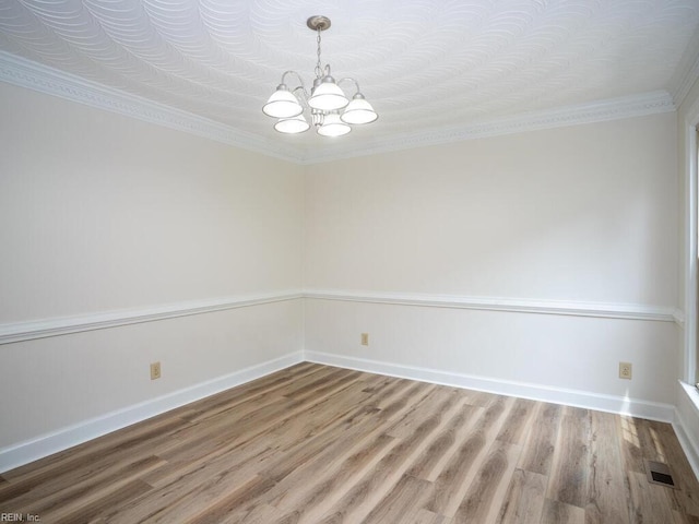 3124 Douglas Rd, Chesapeake, VA 23322 - spare room with a chandelier, light wood-style floors, crown molding, and baseboards