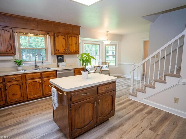 3124 Douglas Rd, Chesapeake, VA 23322 - kitchen featuring a sink, brown cabinets, stainless steel dishwasher, and light wood-type flooring