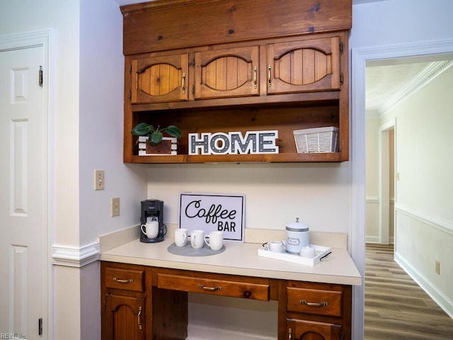 3124 Douglas Rd, Chesapeake, VA 23322 - bar with crown molding, dark wood finished floors, built in desk, and baseboards