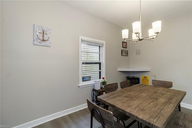 4 Hopkins St, Hampton, VA 23663 - dining space featuring dark wood-type flooring, a chandelier, and baseboards