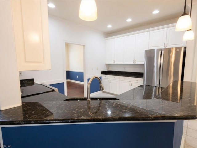 4604 Bellamy Ct, Virginia Beach, VA 23462 - kitchen with freestanding refrigerator, a sink, dark stone countertops, white cabinets, and recessed lighting