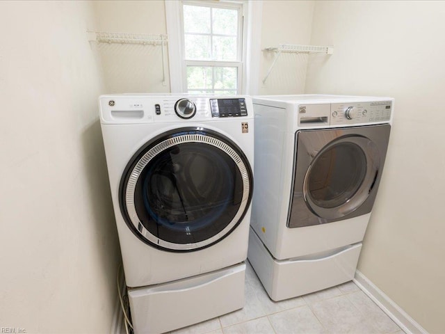 4604 Bellamy Ct, Virginia Beach, VA 23462 - laundry room featuring washing machine and dryer, light tile patterned flooring, and baseboards