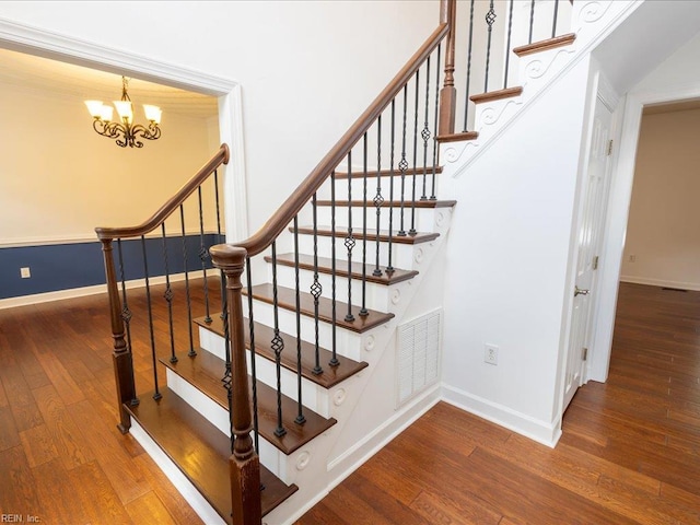4604 Bellamy Ct, Virginia Beach, VA 23462 - stairway with wood finished floors, a chandelier, and baseboards