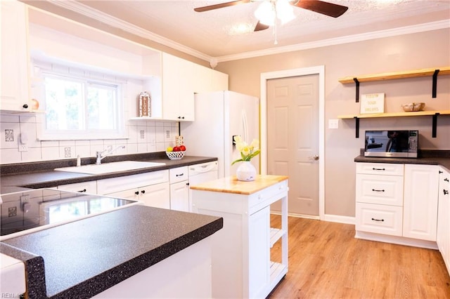 4505 Hessian Ct, Virginia Beach, VA 23462 - kitchen with a sink, stainless steel microwave, freestanding refrigerator, a ceiling fan, and white cabinets