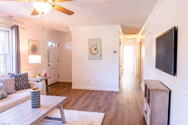 4505 Hessian Ct, Virginia Beach, VA 23462 - living room with a textured ceiling, plenty of natural light, wood finished floors, crown molding, and a ceiling fan