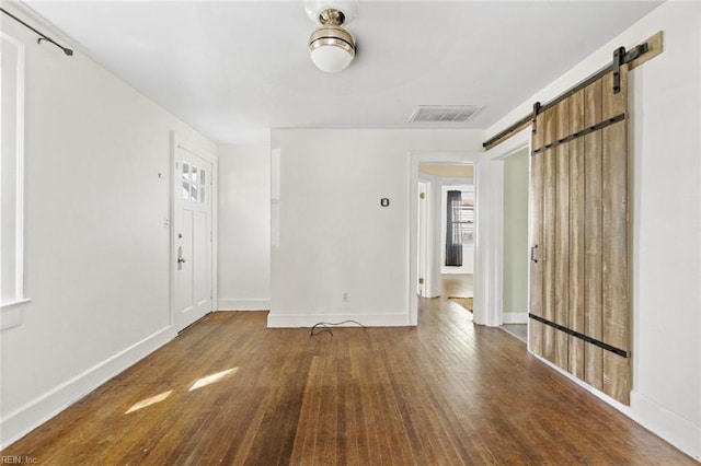 858 47th St, Norfolk, VA 23508 - entrance foyer with a barn door, wood finished floors, healthy amount of natural light, and baseboards