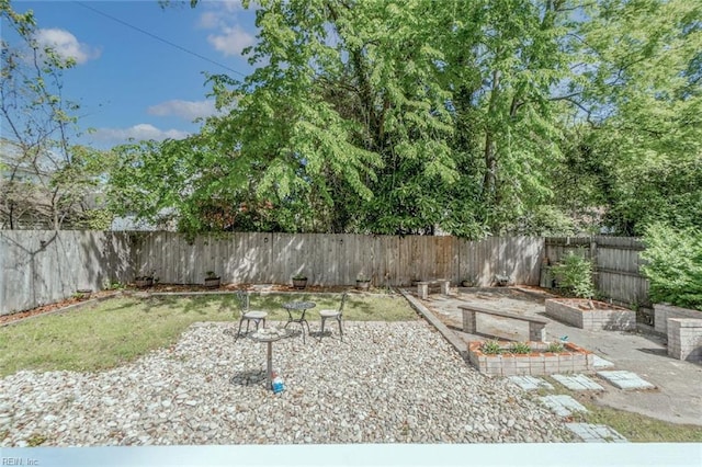 858 47th St, Norfolk, VA 23508 - fenced backyard with a vegetable garden and a patio