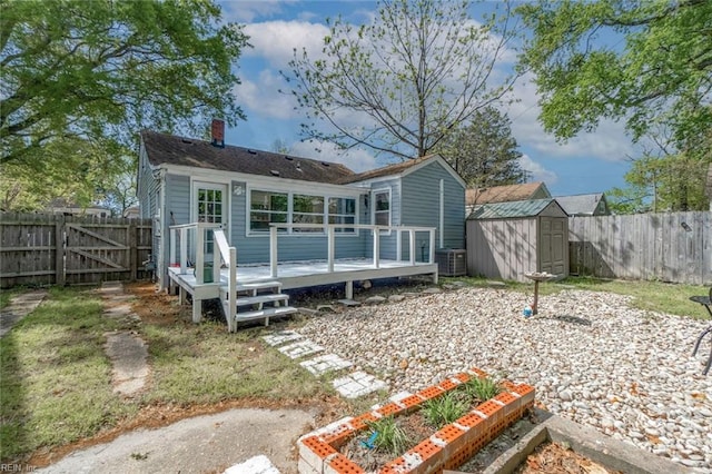 858 47th St, Norfolk, VA 23508 - rear view of property with a wooden deck, a chimney, a fenced backyard, and a gate