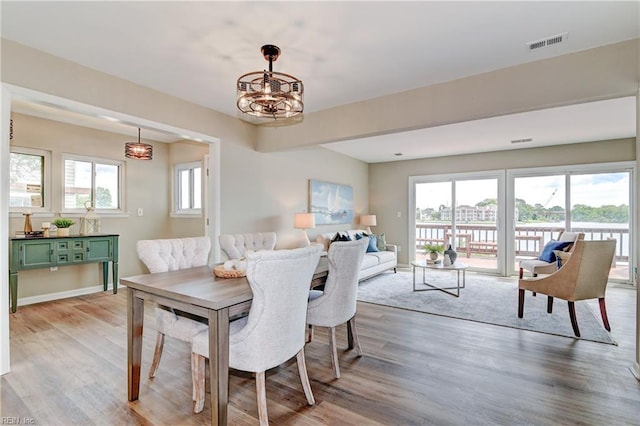 166 Mill Point Dr, Hampton, VA 23669 - dining space with light wood finished floors and a chandelier