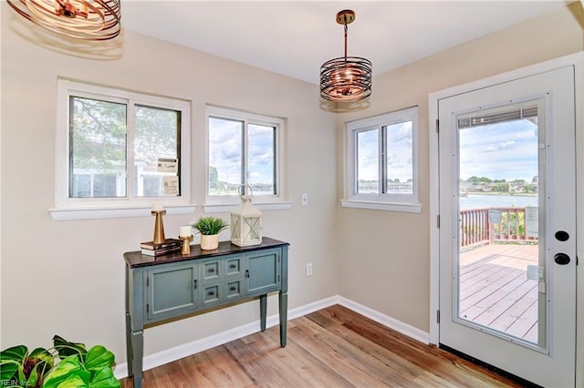 166 Mill Point Dr, Hampton, VA 23669 - doorway to outside with light wood finished floors, a water view, and baseboards