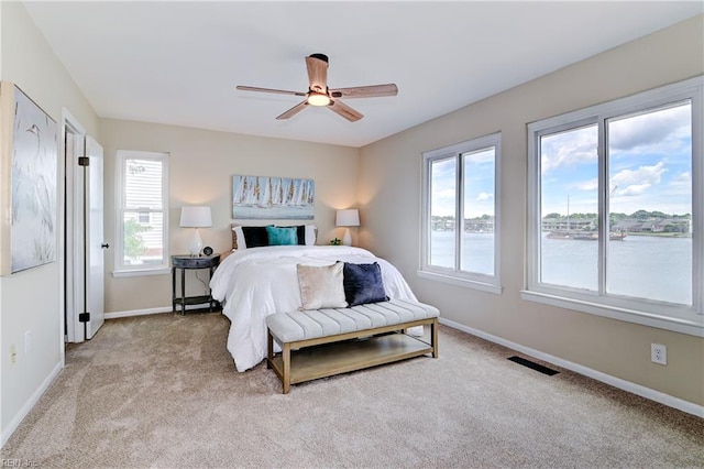 166 Mill Point Dr, Hampton, VA 23669 - bedroom featuring light colored carpet, baseboards, a water view, and a ceiling fan