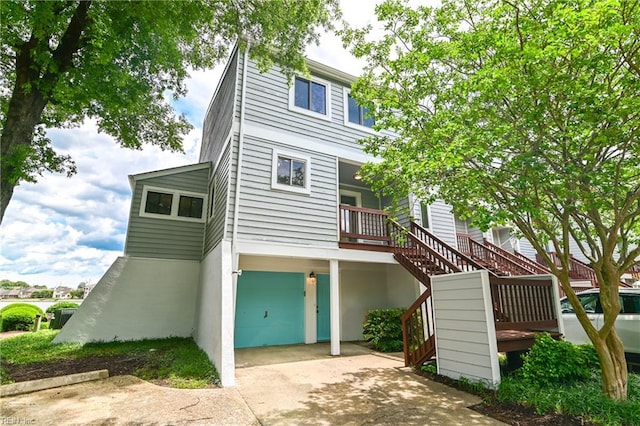 166 Mill Point Dr, Hampton, VA 23669 - view of front facade with an attached garage, stairs, and concrete driveway